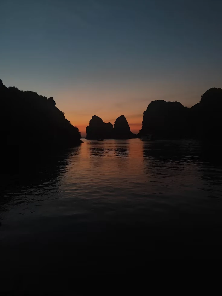 A boat among Ha Long Bay's limestone karsts