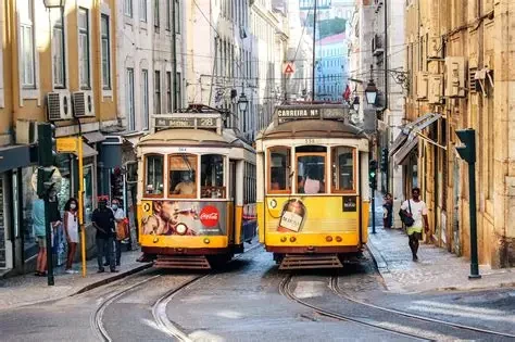 A yellow tram on Lisbon's hilly streets